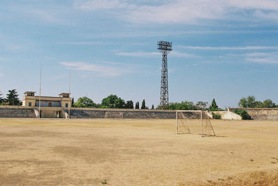 Built structure on field against sky