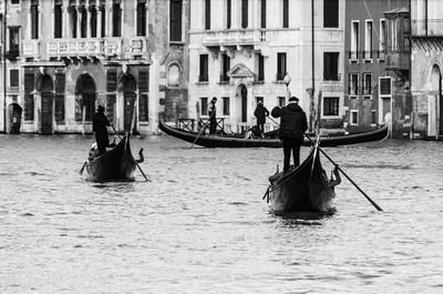 People in boat on canal