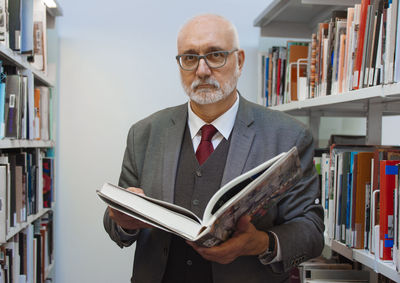 Portrait of man reading book