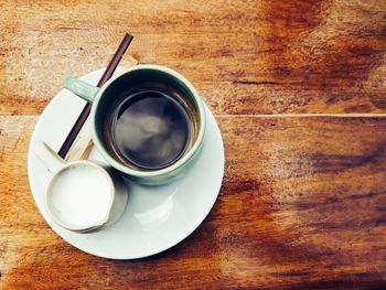 High angle view of coffee cup on table