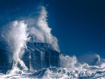 Panoramic view of sea against blue sky