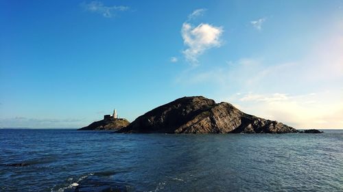 Scenic view of sea against blue sky