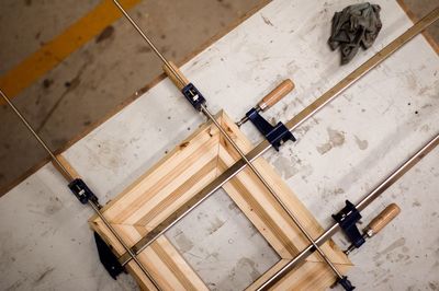 An aerial shot of a wood piece in clamps