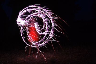 Light painting against sky at night