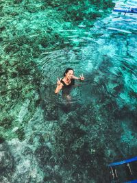 High angle view of woman swimming in pool