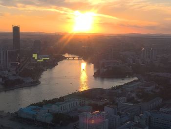 High angle view of city during sunset