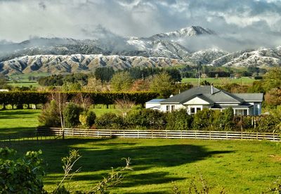 Scenic view of mountains against cloudy sky