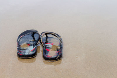 High angle view of shoes on sand