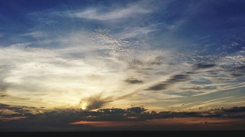 Scenic view of silhouette trees against sky at sunset