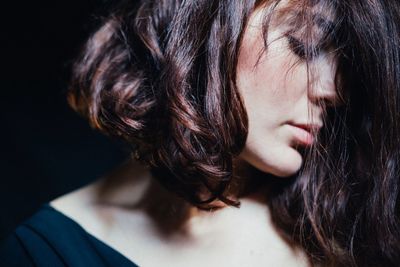 Close-up of young woman with eyes closed