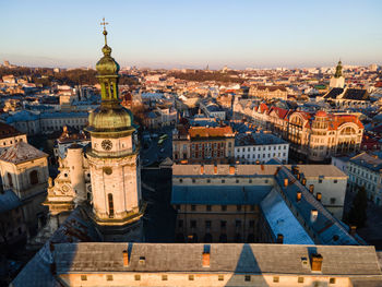 High angle view of city buildings against sky