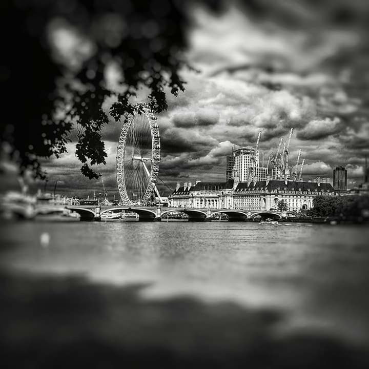 water, architecture, built structure, waterfront, sky, cloud - sky, building exterior, selective focus, nature, city, river, no people, transportation, outdoors, nautical vessel, day, amusement park, amusement park ride