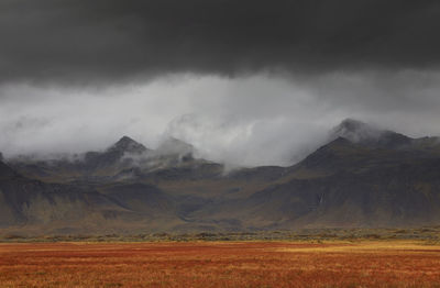 Scenic view of landscape and mountains against sky