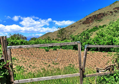 Scenic view of mountains against blue sky