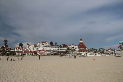 View of beach against cloudy sky