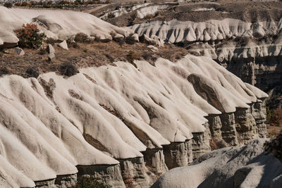 Panoramic shot of icicles hanging on rock