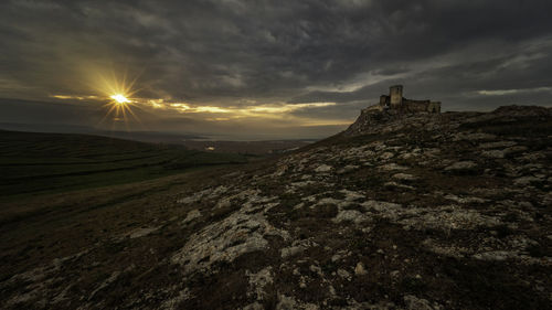 Scenic view of landscape against sky during sunset