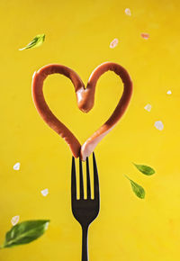 Heart shaped sausage on a fork, valentine's day