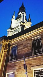 Low angle view of building against blue sky