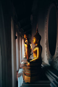 Buddha statue in temple outside building