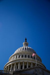 Low angle view of historical building against blue sky