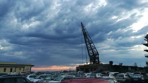 View of crane against cloudy sky