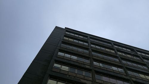 Low angle view of office building against sky