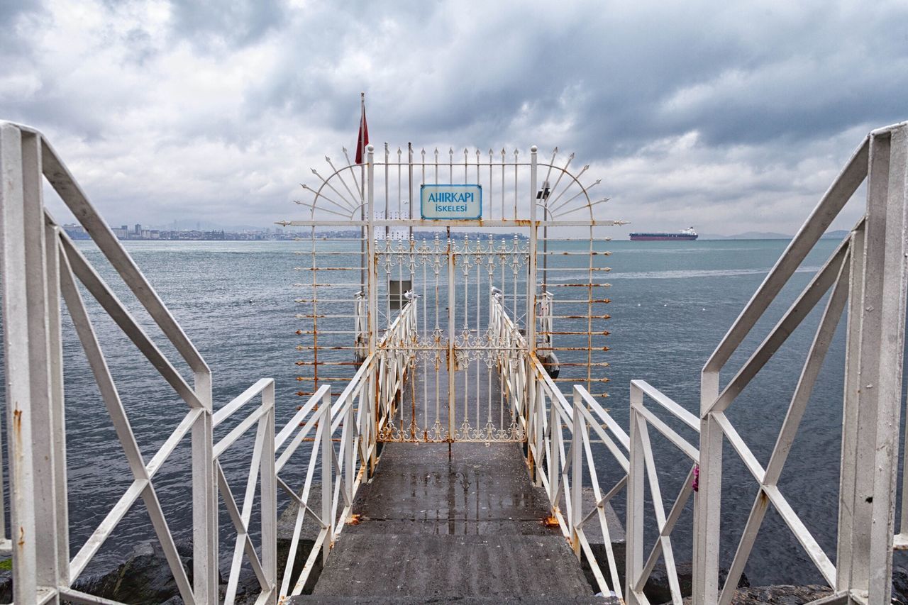 sky, sea, water, the way forward, railing, cloud - sky, transportation, pier, cloudy, built structure, diminishing perspective, nautical vessel, cloud, horizon over water, vanishing point, architecture, tranquility, nature, long, tranquil scene