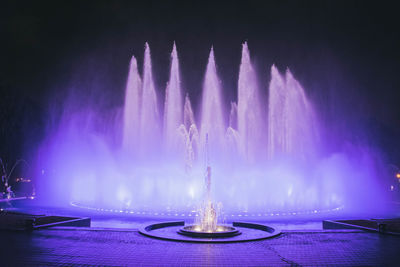 Panoramic view of illuminated fountain at night