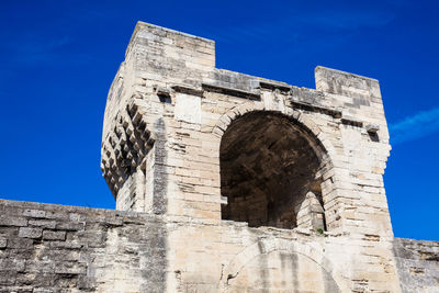 Low angle view of historical building against blue sky