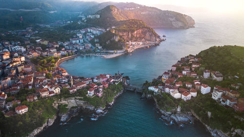 Aerial view of townscape by sea