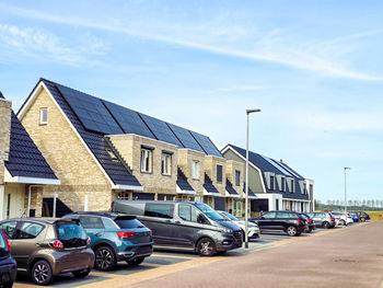 Cars on road against sky