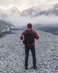 Rear view of man looking at mountain