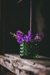 Close-up of purple flower pot on table
