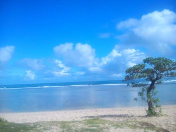 Scenic view of sea against cloudy sky