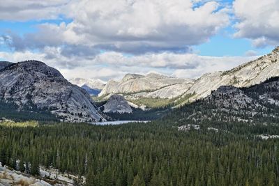 Scenic view of mountains against cloudy sky