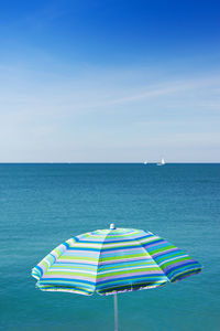 Scenic view of sea against blue sky