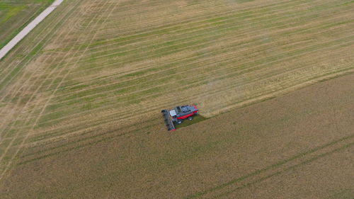 High angle view of combine harvester on agricultural field