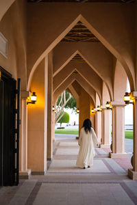 Rear view of woman standing in church