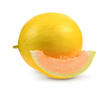 Close-up of orange slice against white background