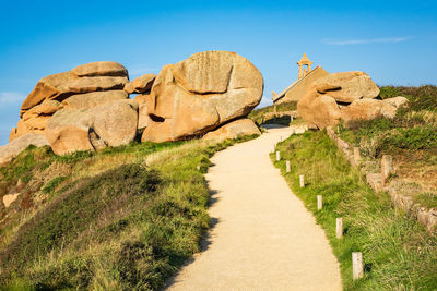 Rock formations against clear blue sky