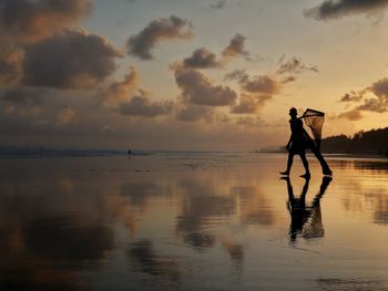 A fishman with sunset background in the cilacap beach