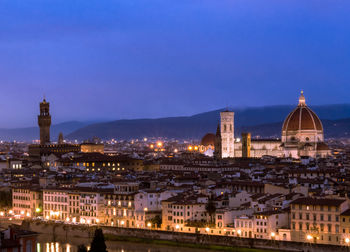 Illuminated buildings in city at night