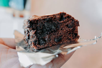 Close-up of hand holding ice cream
