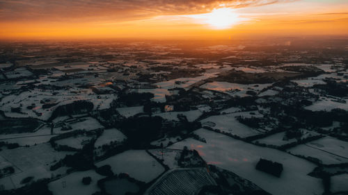 Aerial view of city during sunset