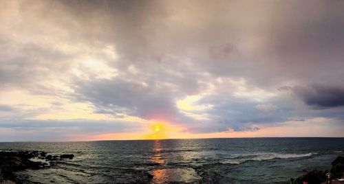 Scenic view of sea against cloudy sky