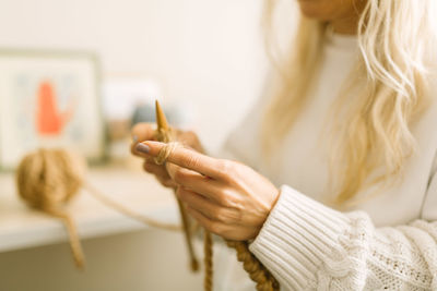 Close-up of woman holding leaf