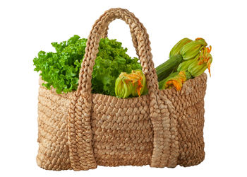 Close-up of wicker basket against white background