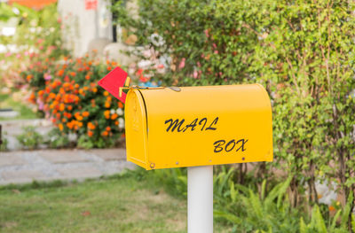 Close-up of yellow mail box