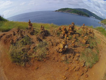 High angle view of land and sea against sky